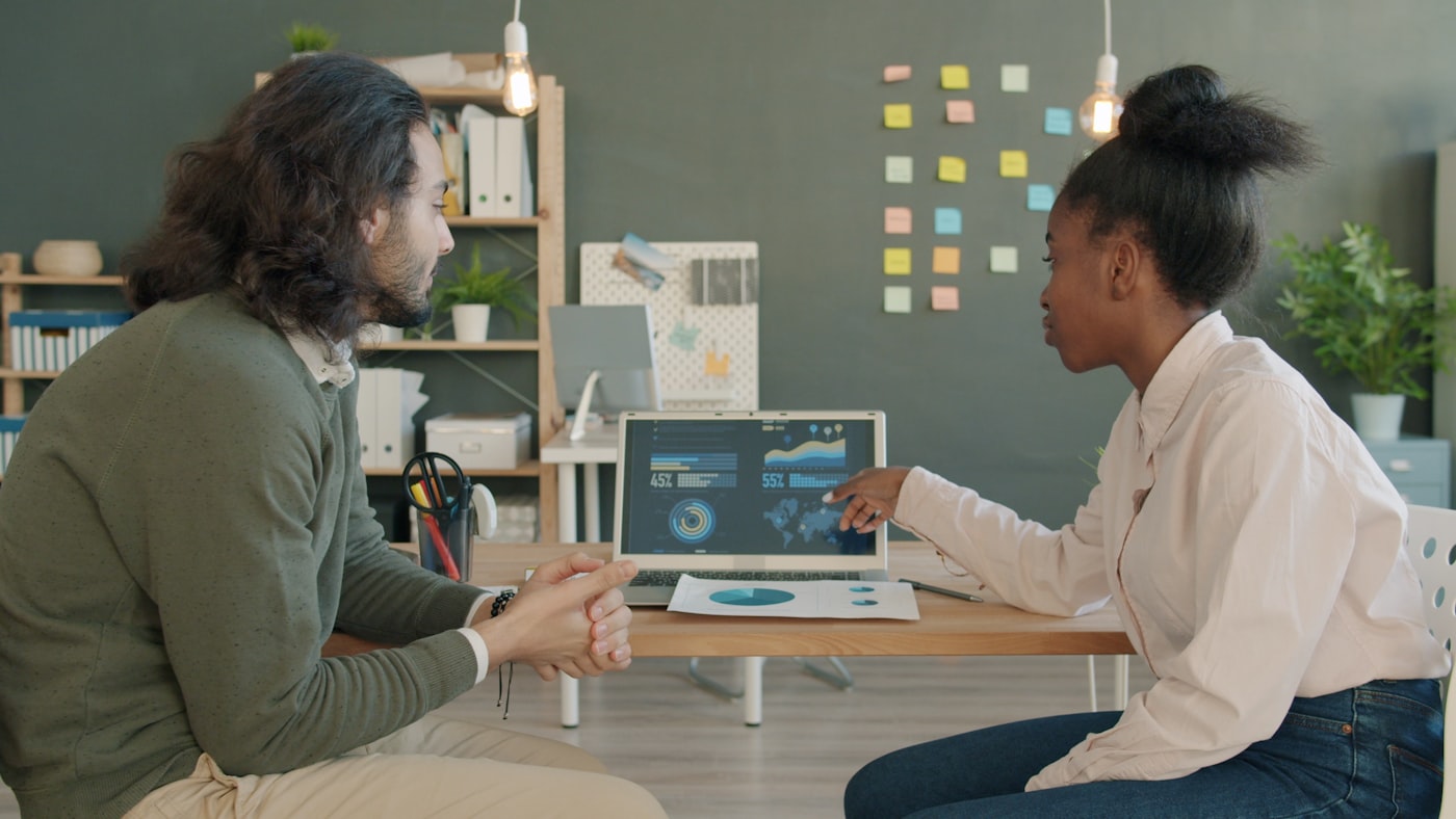 Business analysts working with dashboards